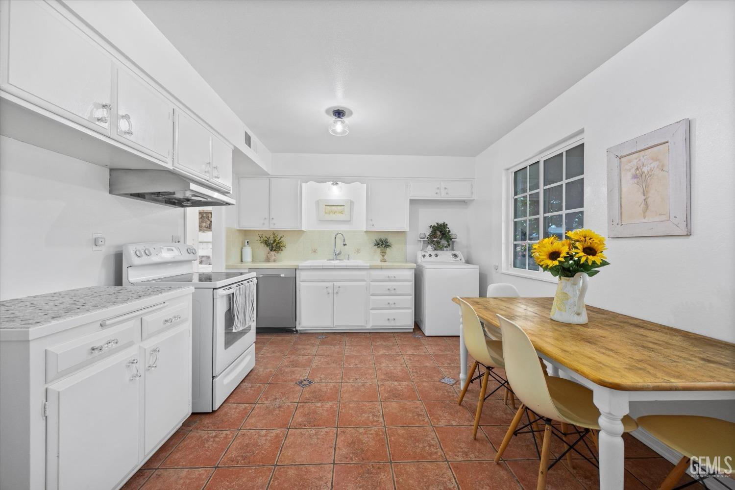 Undisclosed Address Bakersfield, CA 93309 - Photo 11 of 47 a kitchen with a sink cabinets and window
