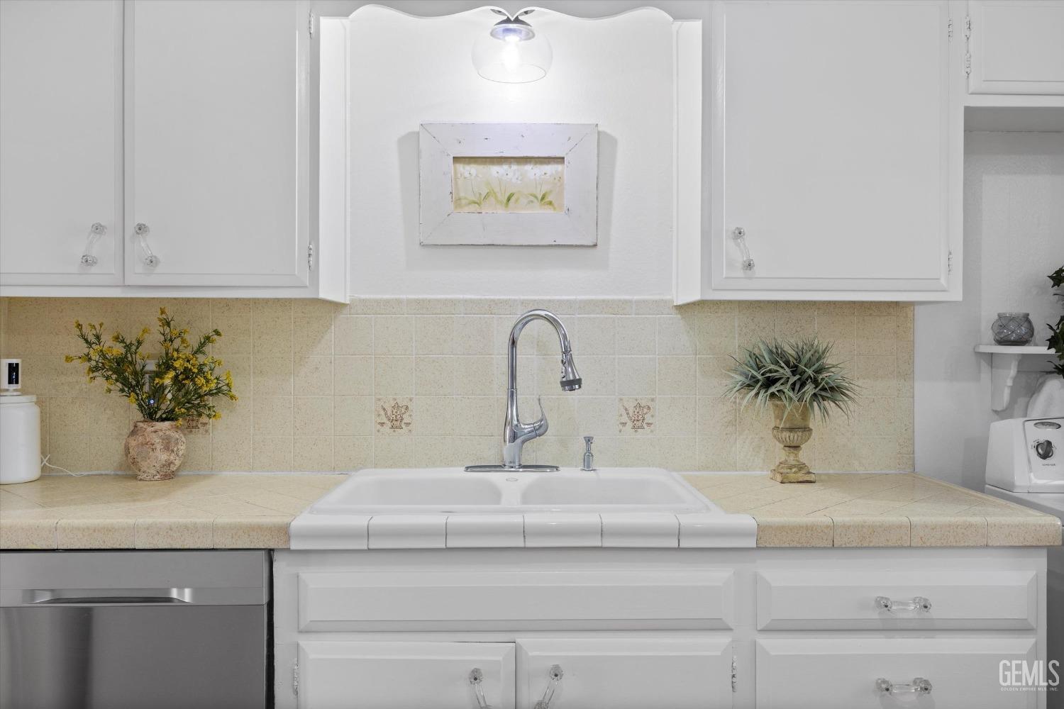 Undisclosed Address Bakersfield, CA 93309 - Photo 13 of 47 a bathroom with a sink and a mirror
