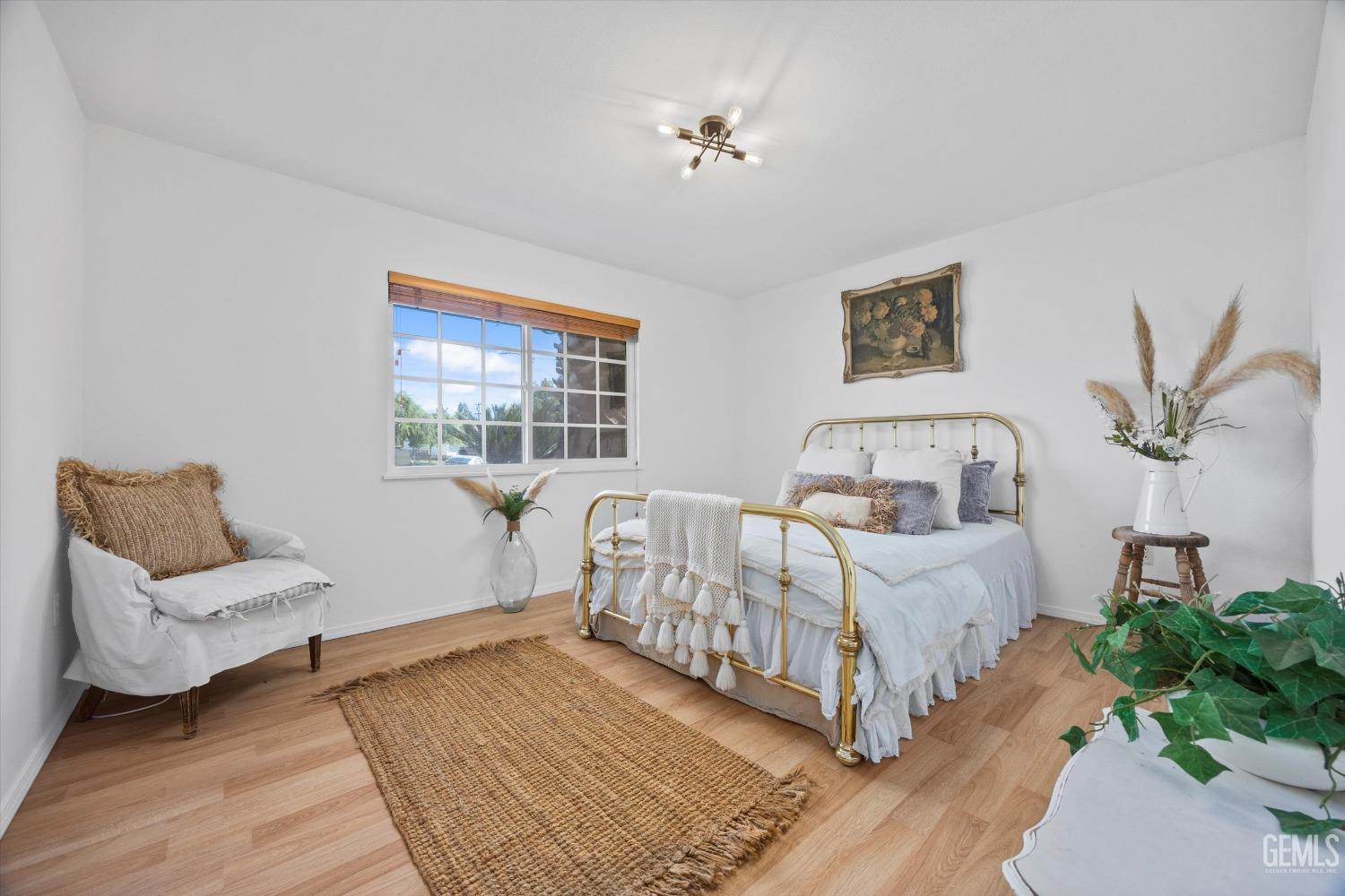 Undisclosed Address Bakersfield, CA 93309 - Photo 19 of 47 a bed room with furniture and a window