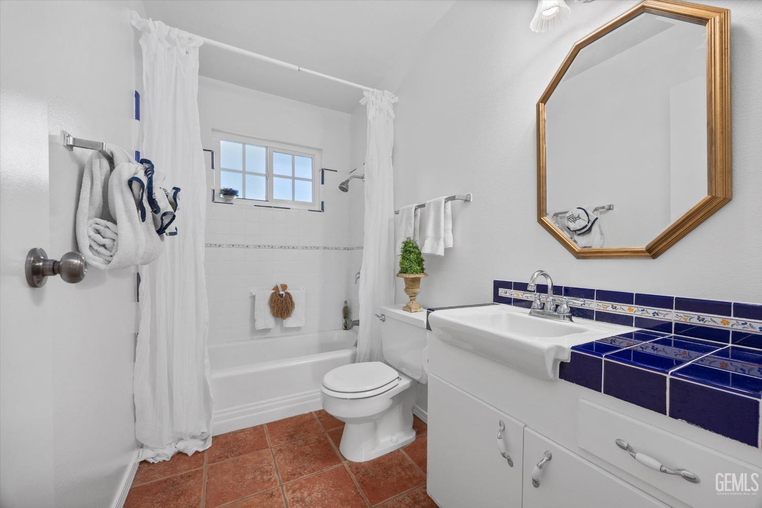 Undisclosed Address Bakersfield, CA 93309 - Photo 21 of 47 a bathroom with a sink a toilet and shower