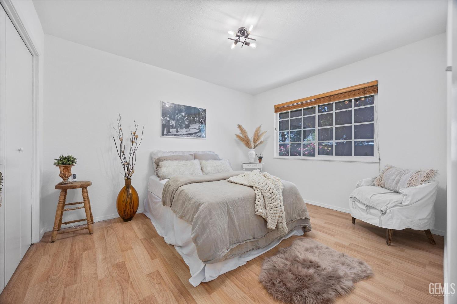 Undisclosed Address Bakersfield, CA 93309 - Photo 22 of 47 a spacious bedroom with a bed and a couch