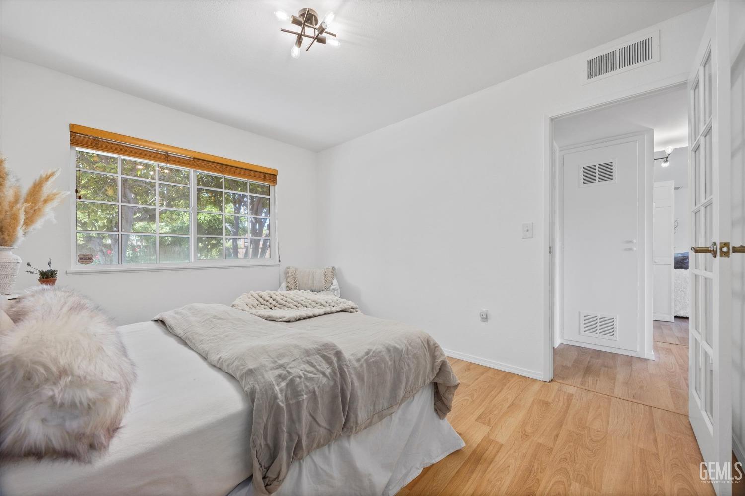 Undisclosed Address Bakersfield, CA 93309 - Photo 23 of 47 a bedroom with a bed and a window