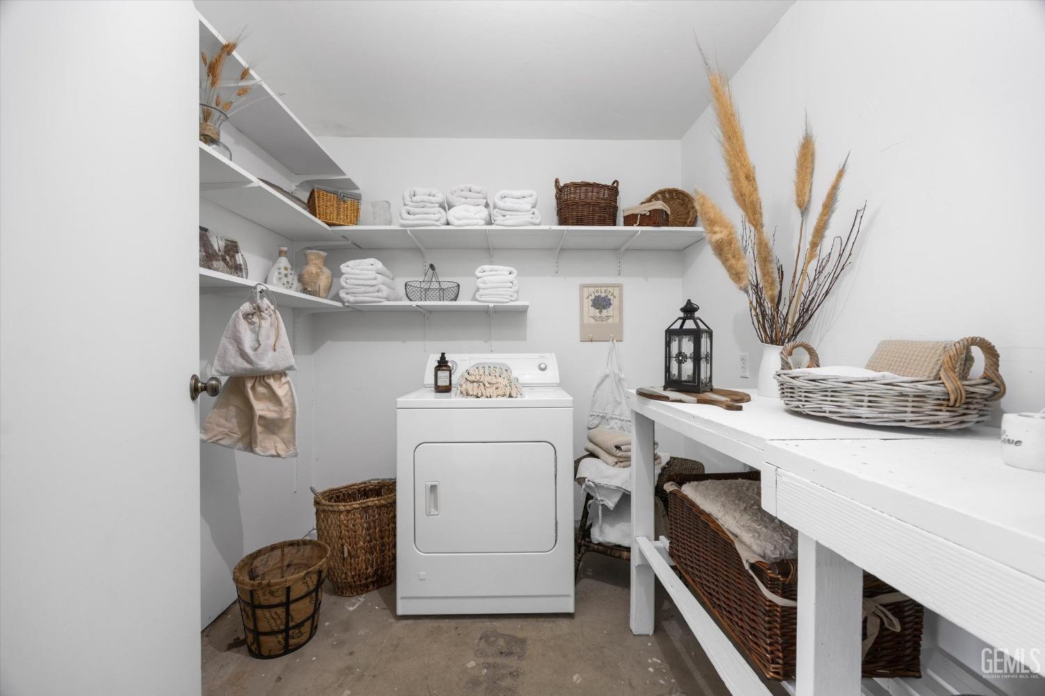 Undisclosed Address Bakersfield, CA 93309 - Photo 24 of 47 a kitchen with stainless steel appliances a sink and cabinets