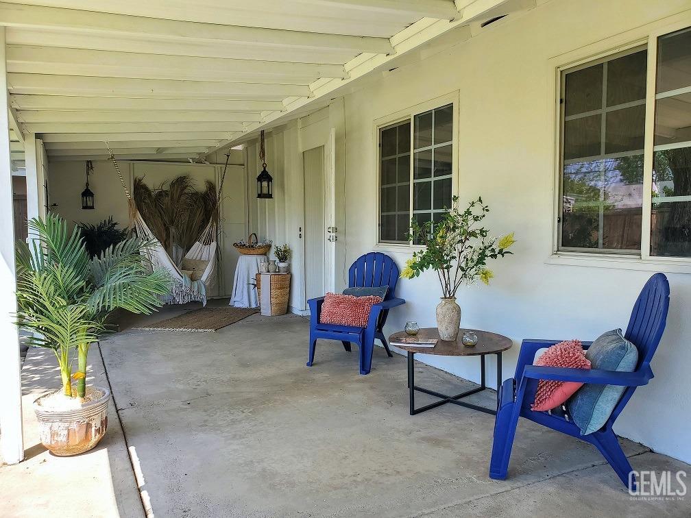 Undisclosed Address Bakersfield, CA 93309 - Photo 32 of 47 a building outdoor space with furniture and potted plants