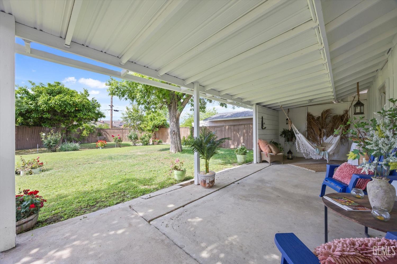 Undisclosed Address Bakersfield, CA 93309 - Photo 34 of 47 a view of a patio with table and chairs and potted plants