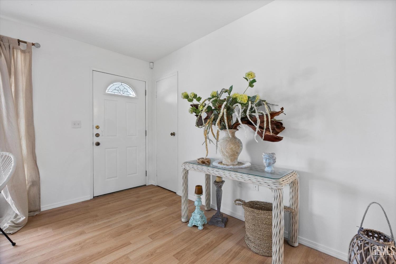 Undisclosed Address Bakersfield, CA 93309 - Photo 7 of 47 a view of living room with wooden floor