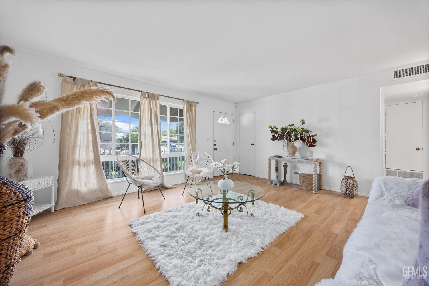Undisclosed Address Bakersfield, CA 93309 - Photo 9 of 47 a living room with furniture rug and wooden floor
