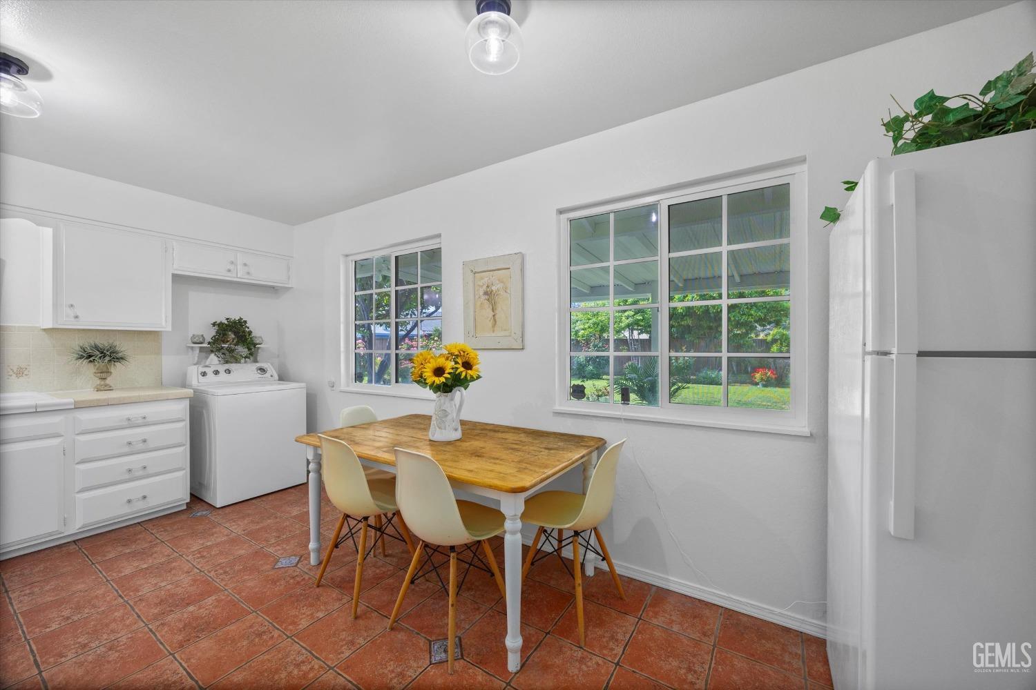 Undisclosed Address Bakersfield, CA 93309 - Photo 10 of 47 a view of a dining room with furniture and a window