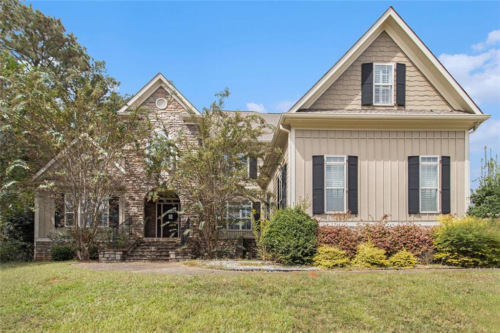 a front view of a house with a yard