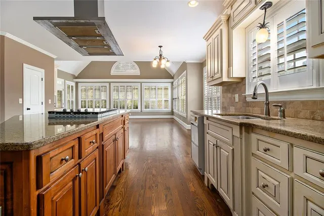 a view of a kitchen cabinets and a wooden floor
