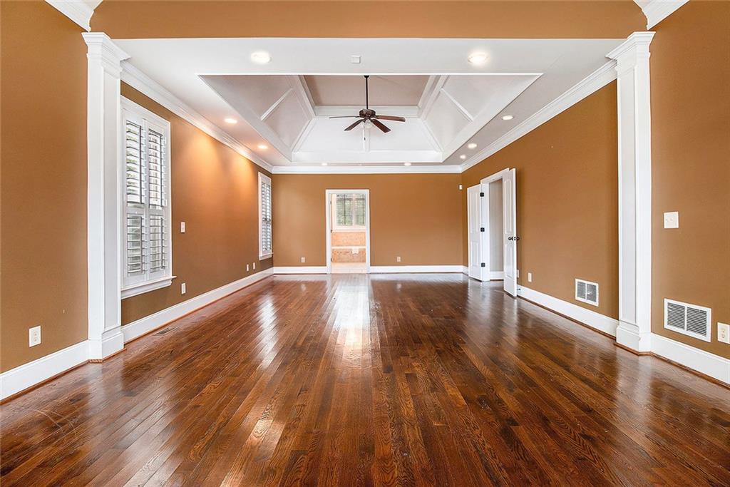 70 Alcovy Reserve Way Covington, GA 30014 - Photo 16 of 30 a view of an empty room with wooden floor and a window