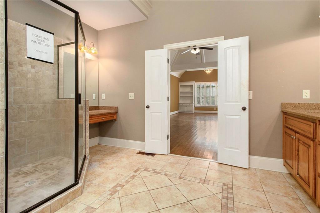 70 Alcovy Reserve Way Covington, GA 30014 - Photo 18 of 30 a view of a hallway with wooden floor and a cabinet