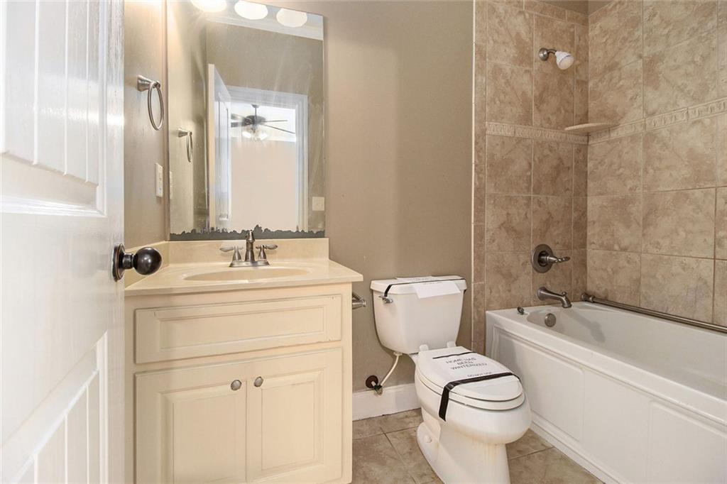 70 Alcovy Reserve Way Covington, GA 30014 - Photo 21 of 30 a bathroom with a sink a toilet and shower