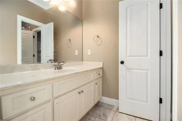 a bathroom with a double vanity sink and mirror