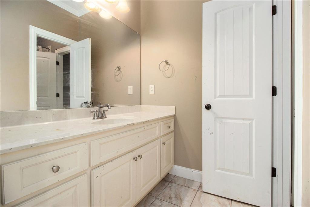 70 Alcovy Reserve Way Covington, GA 30014 - Photo 23 of 30 a bathroom with a double vanity sink and mirror