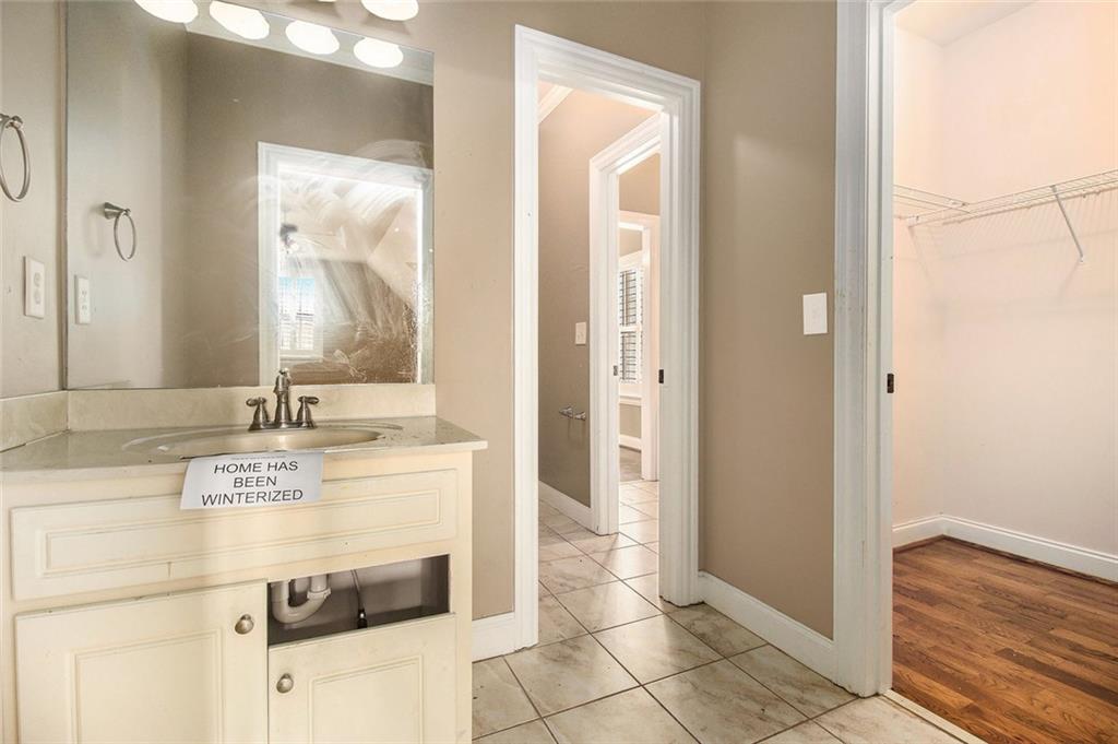 70 Alcovy Reserve Way Covington, GA 30014 - Photo 25 of 30 a bathroom with a sink a mirror and a shower