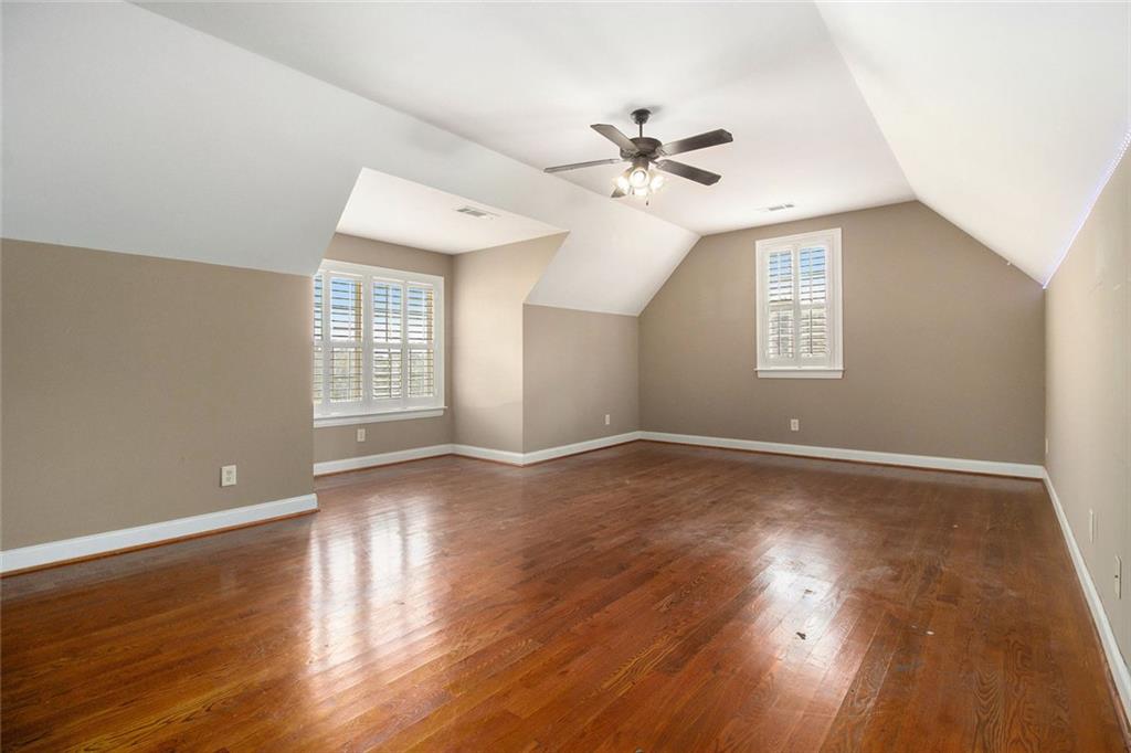 70 Alcovy Reserve Way Covington, GA 30014 - Photo 26 of 30 a view of an empty room with wooden floor and a window