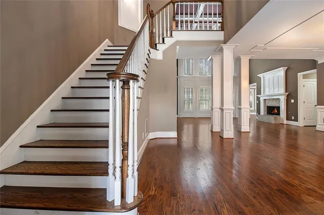 a view of entryway and hall with wooden floor