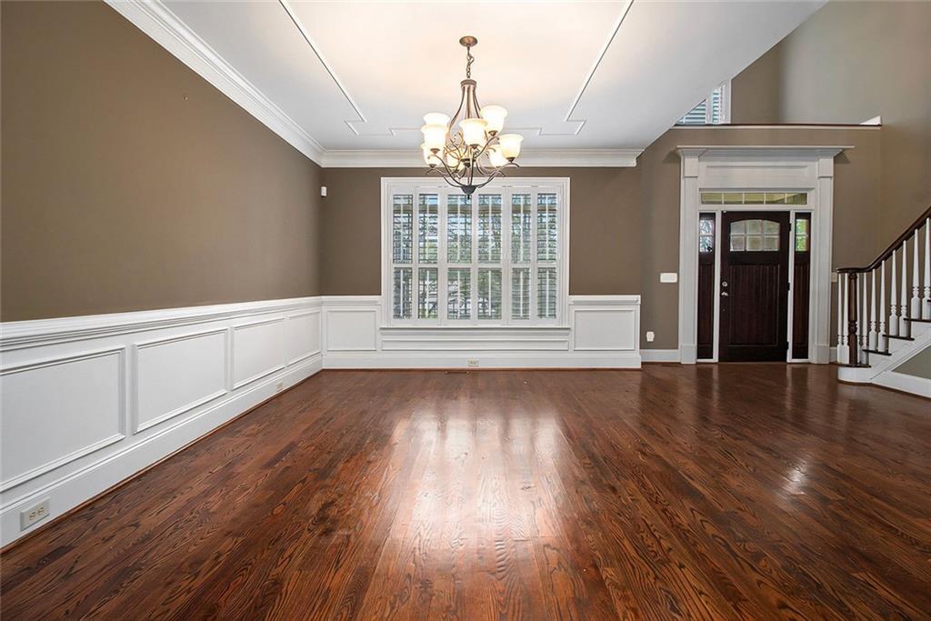70 Alcovy Reserve Way Covington, GA 30014 - Photo 4 of 30 a view of an empty room with wooden floor and a window