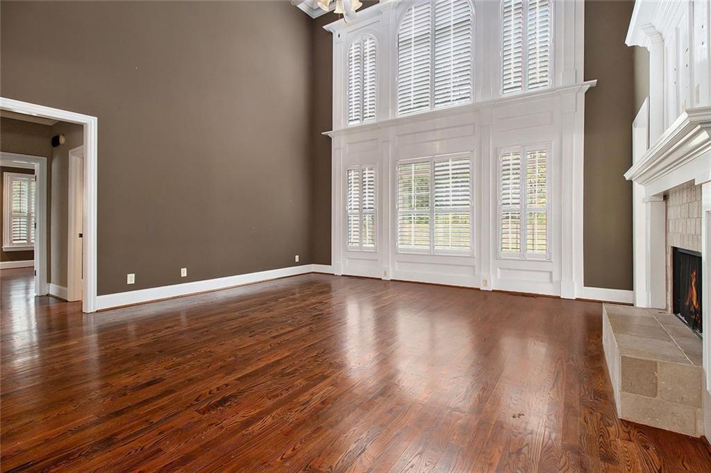70 Alcovy Reserve Way Covington, GA 30014 - Photo 5 of 30 an empty room with wooden floor and windows