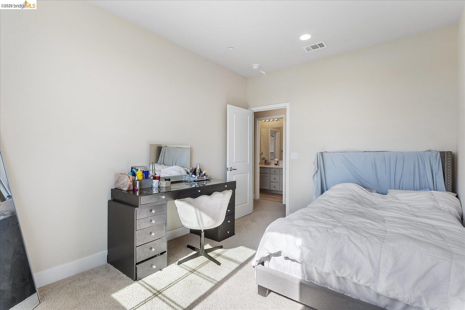 5601 Ridgepoint Way Antioch, CA 94531 - Photo 30 of 59 Bedroom featuring neutral carpet flooring, recessed lighting, and an entryway to an attached bathroom with a dual vanity
