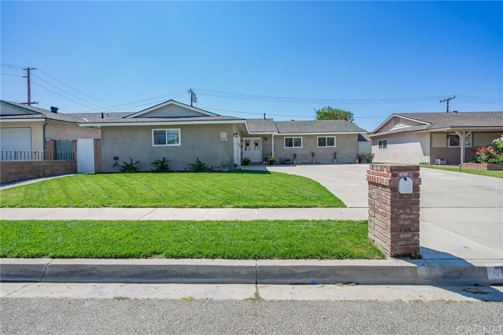 1722 Fitzgerald Road Simi Valley, CA 93065 - Photo 1 of 1 a front view of a house with a yard and garage