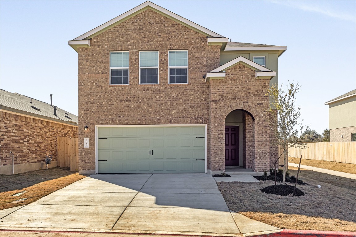 202 Sunset Deer Lane Georgetown, TX 78628 - Photo 1 of 1 a front view of a house