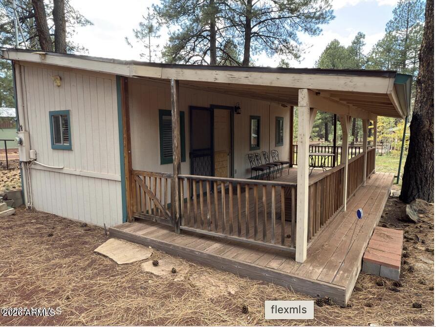 7261 East Long Bow Drive Williams, AZ 86046 - Photo 13 of 26 a view of a house with a wooden fence