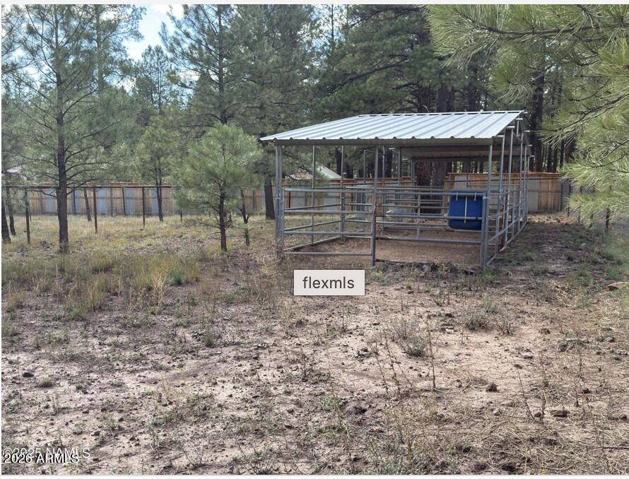 7261 East Long Bow Drive Williams, AZ 86046 - Photo 4 of 26 a backyard of a house with seating space