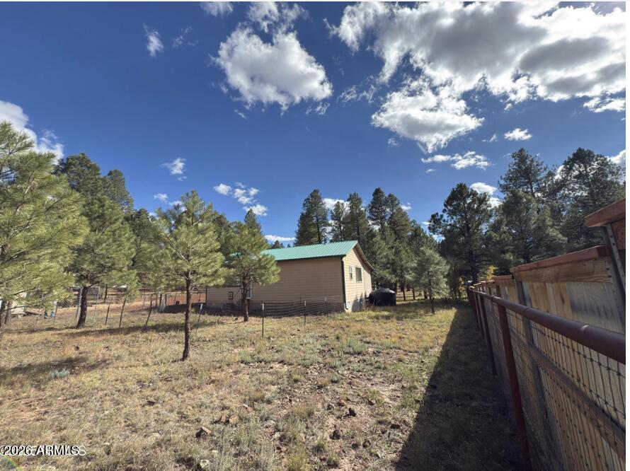 7261 East Long Bow Drive Williams, AZ 86046 - Photo 6 of 26 a view of a house with a snow in a yard
