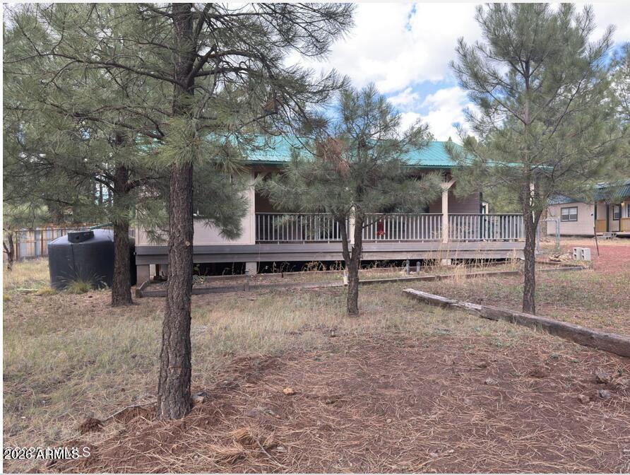7261 East Long Bow Drive Williams, AZ 86046 - Photo 7 of 26 a backyard of a house with trampoline