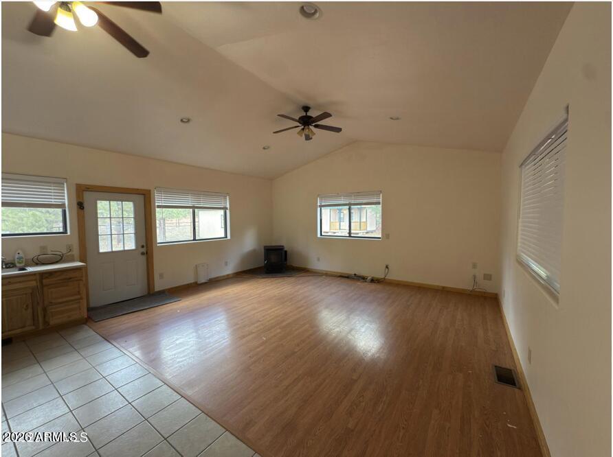 7261 East Long Bow Drive Williams, AZ 86046 - Photo 8 of 26 wooden floor in an empty room with a window