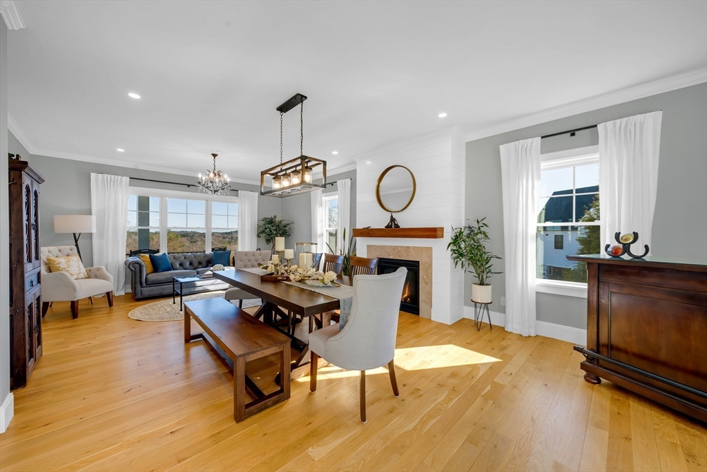 62 Seven Sister Road Haverhill, MA 01830 - Photo 16 of 42 a living room with fireplace furniture and a wooden floor