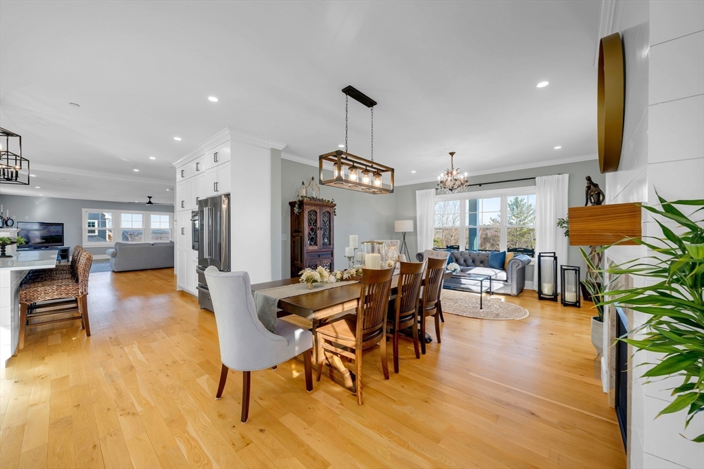 62 Seven Sister Road Haverhill, MA 01830 - Photo 17 of 42 a view of a dining room with furniture and wooden floor