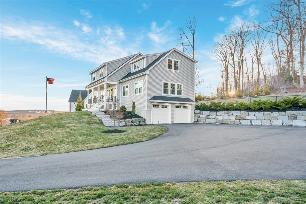 62 Seven Sister Road Haverhill, MA 01830 - Photo 2 of 42 a front view of a house with a yard and potted plants