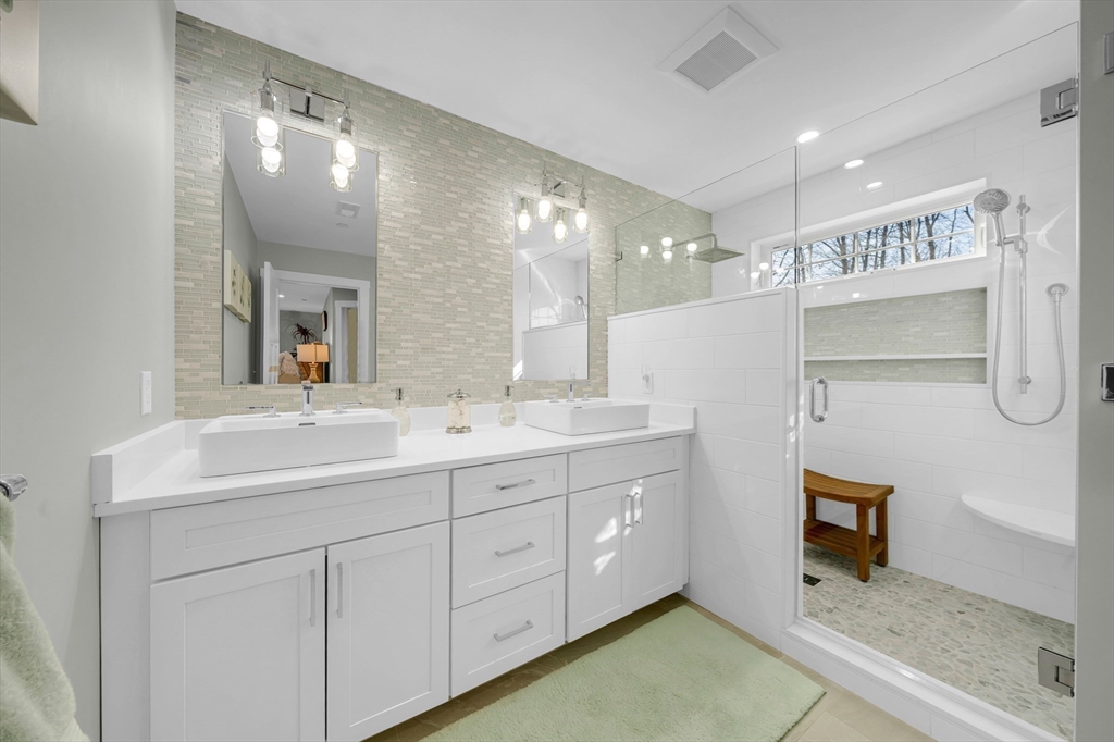 62 Seven Sister Road Haverhill, MA 01830 - Photo 28 of 42 a spacious bathroom with a double vanity sink and mirror