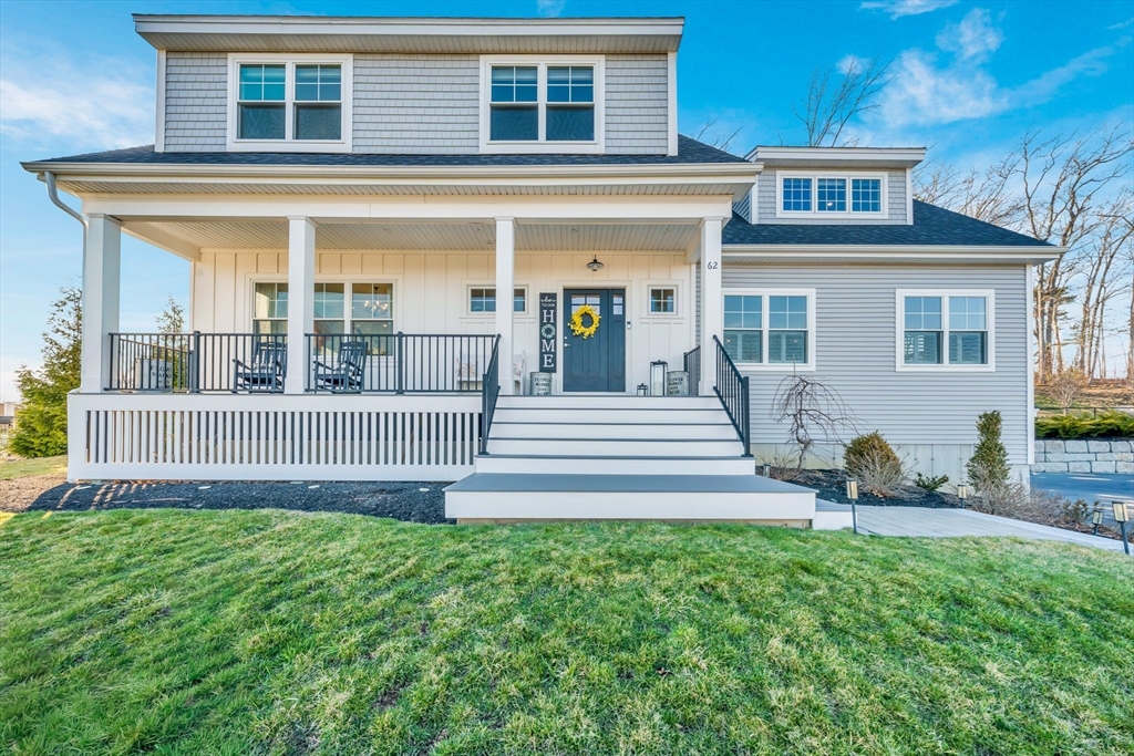 62 Seven Sister Road Haverhill, MA 01830 - Photo 3 of 42 a front view of a house with a yard