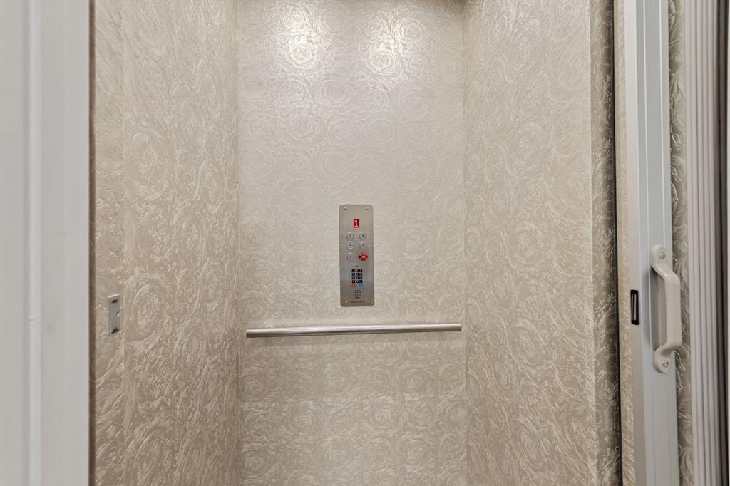 7854 Element Avenue Plano, TX 75024 - Photo 4 of 38 Elevator featuring Versace wallpaper and custom tile flooring