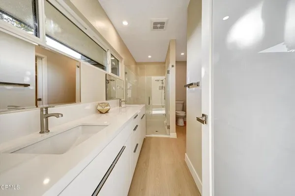 a bathroom with a shower and a toilet