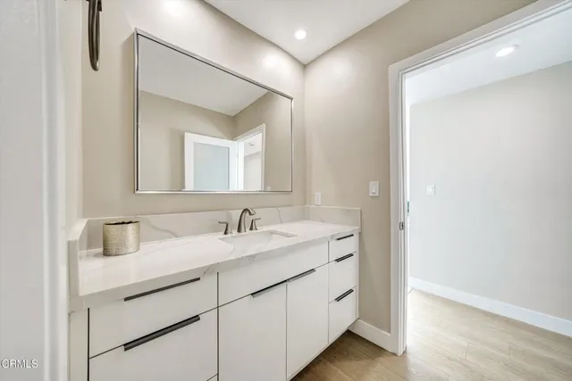 a kitchen with a stove a sink and a microwave