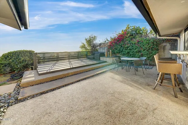 a view of outdoor space with wooden floor