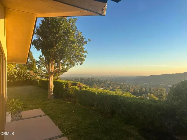a view of a town with mountains in the background