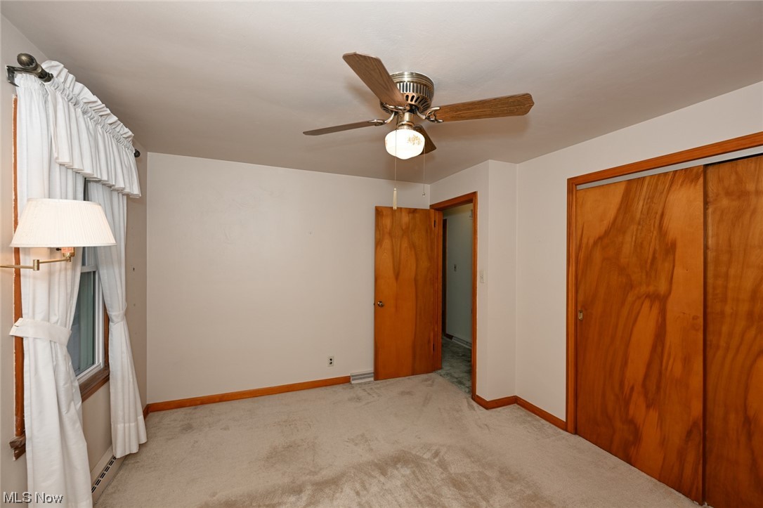 849 Bears Den Road Youngstown, OH 44511 - Photo 14 of 28 Carpeted bedroom featuring a baseboard radiator and ceiling fan