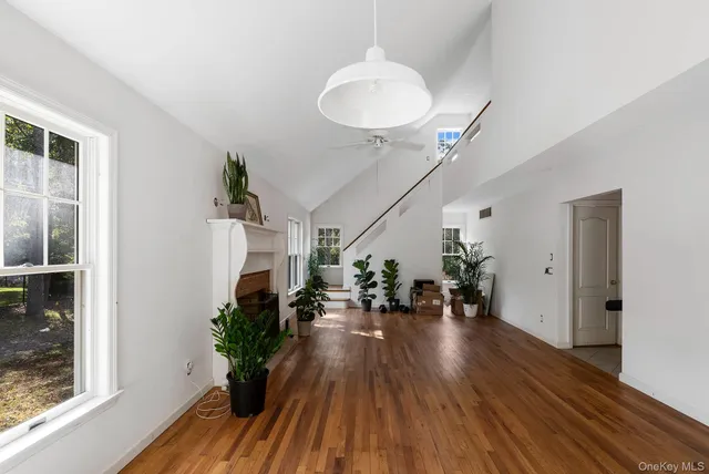 a view of livingroom and dining room with wooden floor