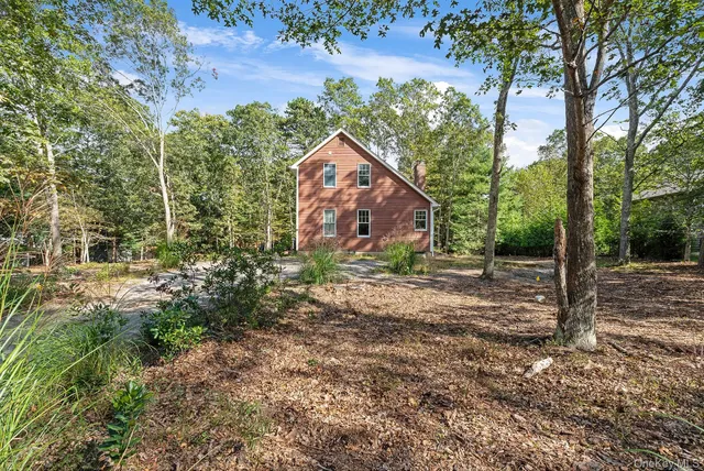a backyard of a house with lots of green space