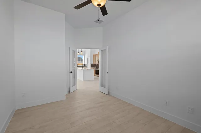 a view of an empty room with a window