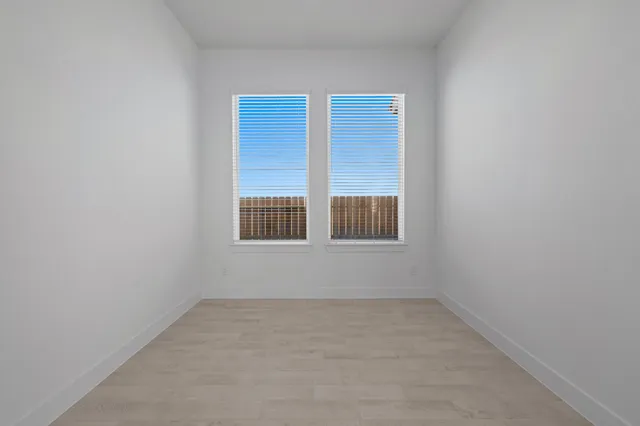 an empty room with windows