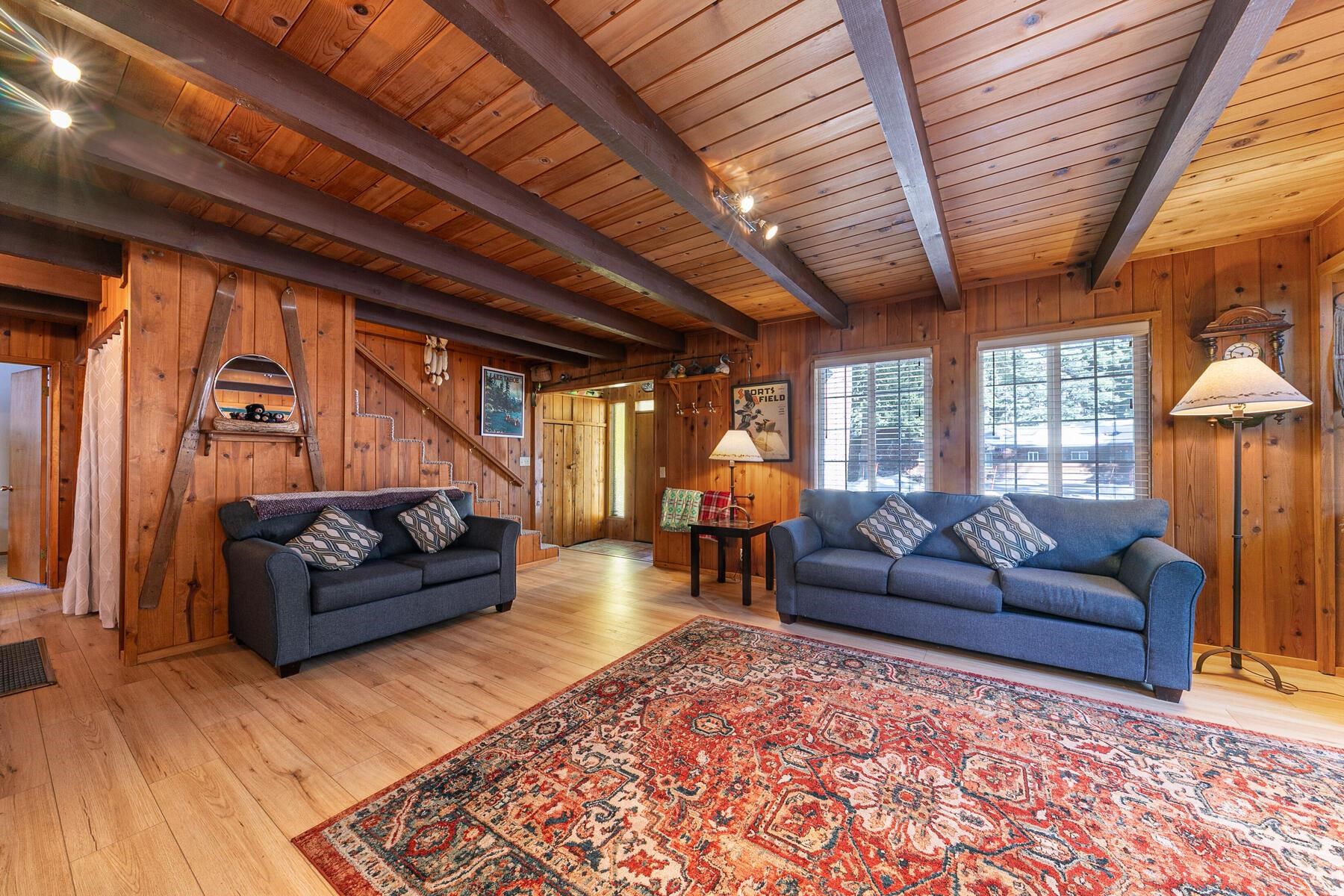 5749 Dodowah Road Carnelian Bay, CA 96140 - Photo 13 of 28 a living room with furniture and a wooden floor