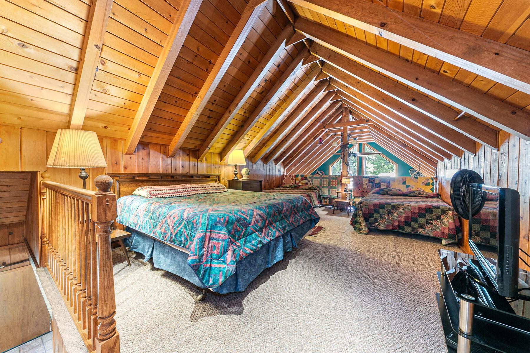 5749 Dodowah Road Carnelian Bay, CA 96140 - Photo 17 of 28 a bedroom with a bed and a walk in closet