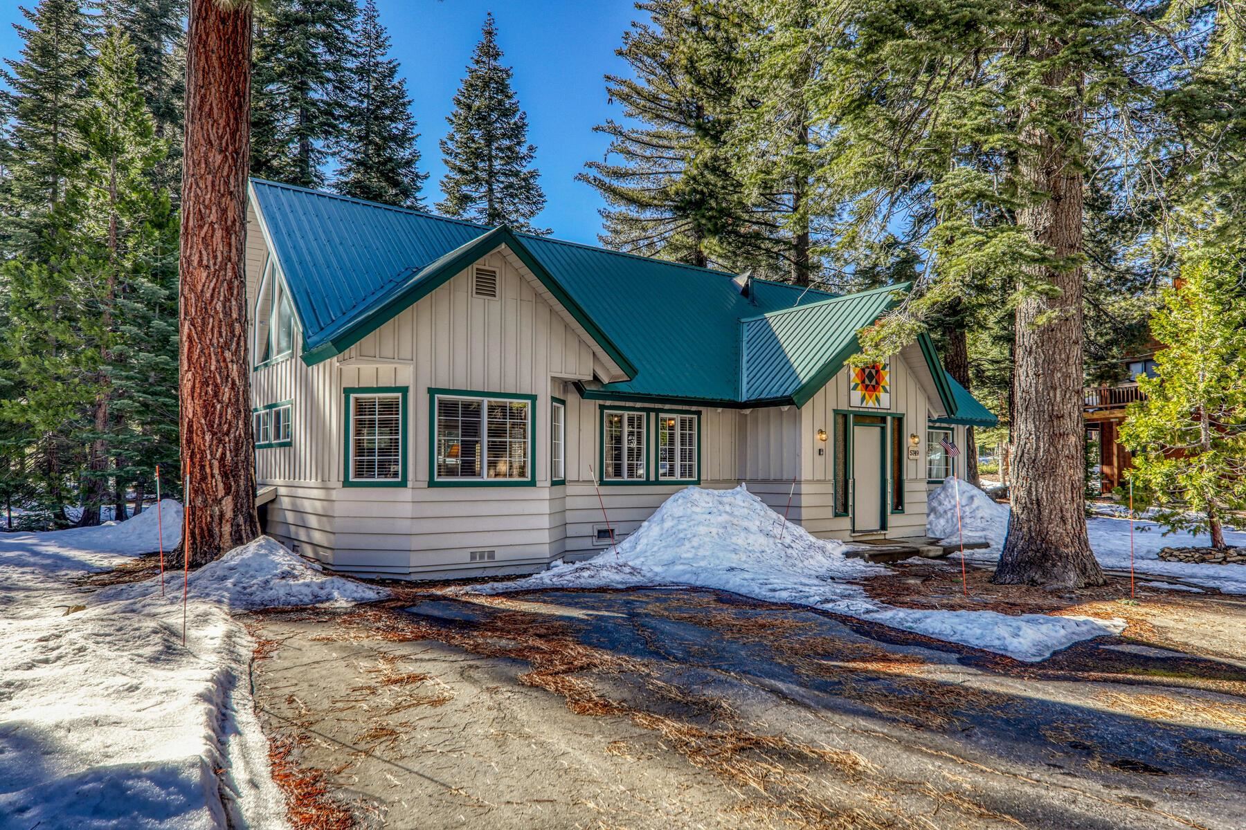 5749 Dodowah Road Carnelian Bay, CA 96140 - Photo 24 of 28 a front view of a house with a yard and porch